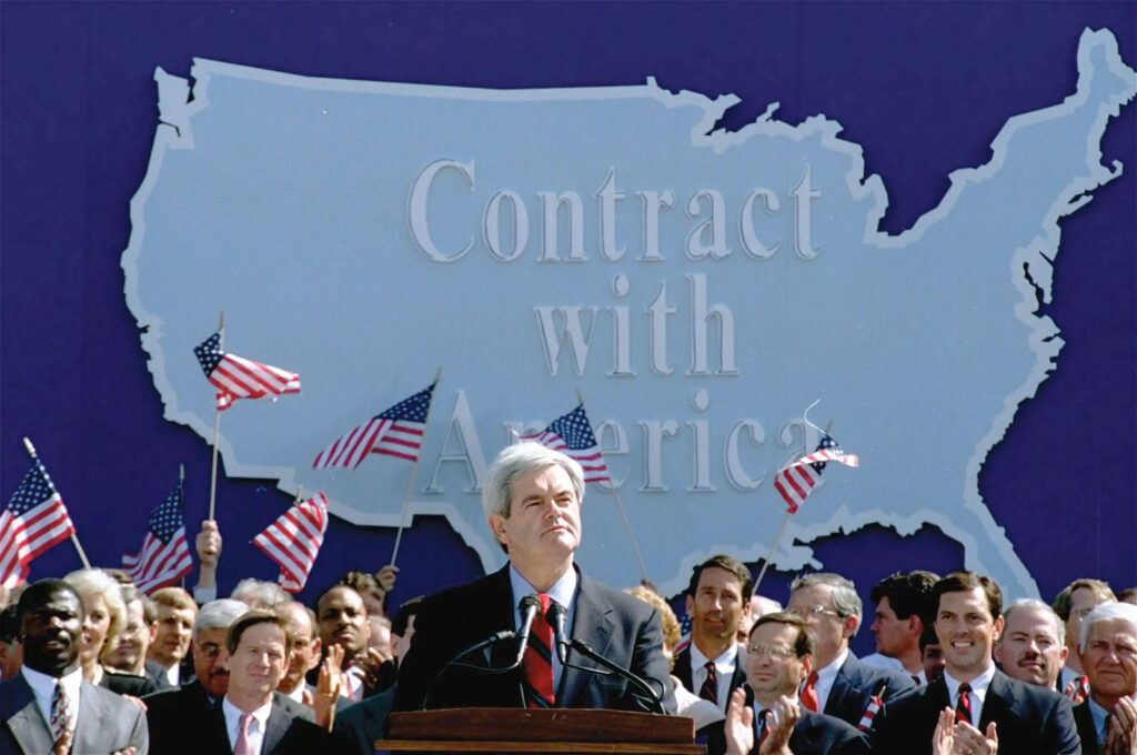 Speaker of the House of Representatives Newt Gingrich presents his Contract with America in in front of a huge map of the USA.