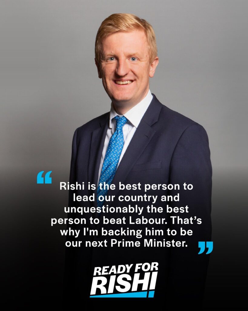 Official three-quarter length portrait of Oliver Dowden MP, smiling broadly. Text overlaid reads: 'Rishi is the best person to lead our country and unquestionably the best person to beat Labour. That's wht I'm backing him to be our next Prime Minister.' Ready for Rishi